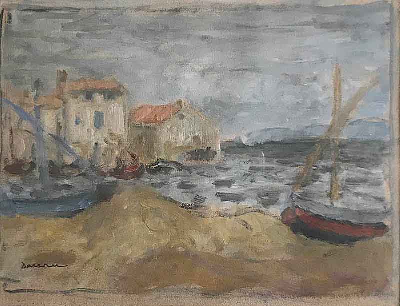Two boats on a beach with sea and buildings beneath a cloudy sky.